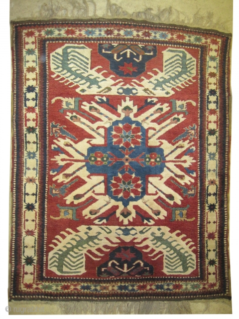 
Tchelaberd Dragon Caucasian circa 1915 antique. Collector's item. Size: 170 x 140 (cm) 5' 7" x 4' 7"  carpet ID: K-3308
The two dragons are ivory and soft green, the two edges  ...