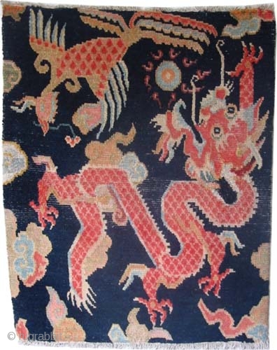 
Tibetan knotted circa in 1925 semi antique, 76 x 60 (cm) 2' 6" x 2'  carpet ID: K-4888
Dragon design, the background color is indigo, certain places are repaired, very soft.

A similar  ...