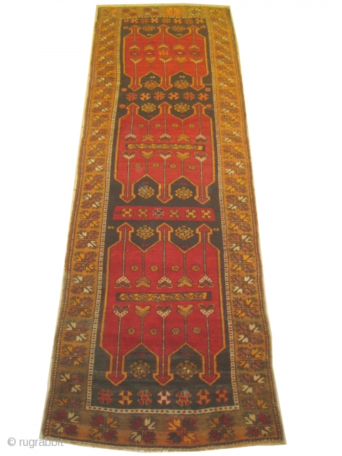 Karapinar Turkish, semi antique, 105 x 315 cm, carpet ID: SRO-9
The three medallions at the center are soft red with tulips, thigh pile in perfect condition.       