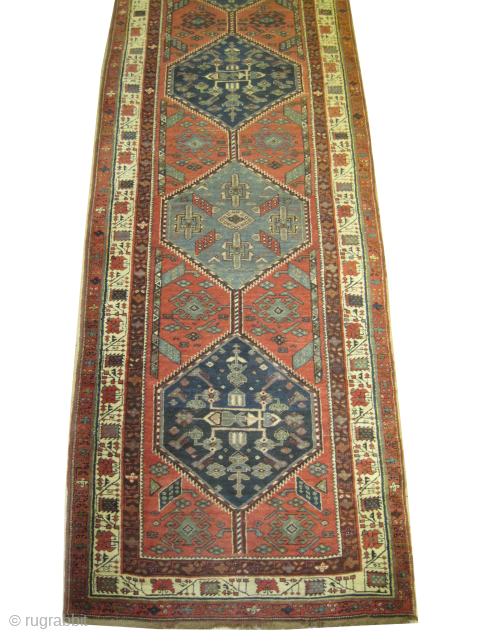 
Serap Persian, knotted circa 1920 antique, 115 x 437 cm, ID: K-3274
The black knots are oxidized, vegetable dyes, the knots are hand spun wool, the shirazi borders are woven on two lines,  ...