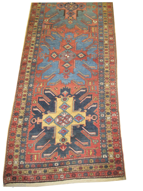 

Heriz Persian, knotted circa 1915, antique, 109 x 430 cm, ID: K-4437
Vegetable dyes, the black knots are oxidized, the knots are hand spun wool, the background color is rust with five center  ...