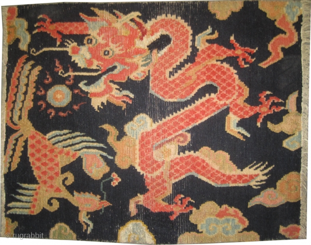 
Dragon Tibetan knotted circa 1925, collectors item, 76 x 60cm, ID: K-4888
Dragon design, the background color is indigo, the knots are hand spun lamb wool, minor places are repaired, thick pile and  ...