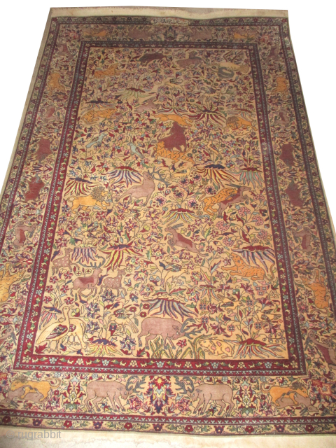 Our new website: www.madayancarpets.ch 

Indian carpet, semi-antique, 140 x 211 cm, ID: HK-1
Signed, hunting design, very finely knotted circa 300’000 knots in square meter, the background color and the surrounded large border  ...