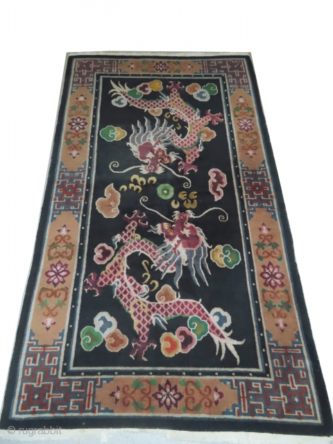 Tibetan dragon rug, knotted circa in 1935, semi antique, 118 x 205 cm, carpet ID: BRDI-37
The knots are hand spun wool, the background in indigo with two dragons, thick pile in perfect  ...