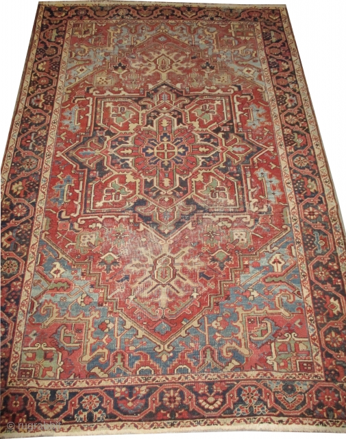 Heriz Persian knotted circa in 1915 antique, 304 x 206 
 carpet ID: P-5244
The black knots are oxidized, the knots are hand spun wool, the background color is terracotta, the center medallion  ...