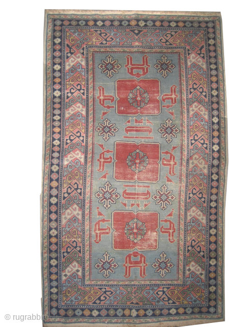 Karakashli Caucasian, knotted circa 1940, 87 x 142 cm, ID: OZ-1
At the center certain places the pile is slightly used, the background color is sky blue with traditional Karakashli design, the surrounded ...