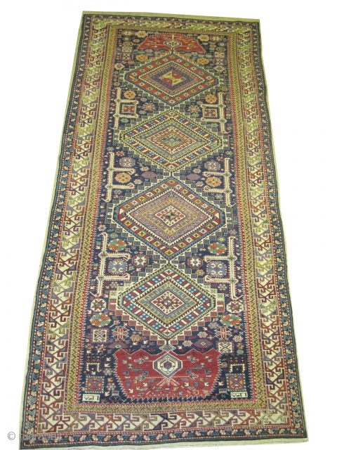 	

Shirvan Caucasian antique and dated 1303 = 1885. Collectors item. Size: 334 x 150 (cm) 10' 11" x 4' 11"  carpet ID: W-9
The date is knotted at the two corners. High  ...