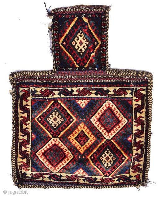 A PERSIAN, KURDISH SALT BAG, the central panel with five hooked polychrome diamonds within a stylised animal border on a white ground with banded flat weave back, 66 x 53.5cm overall as  ...