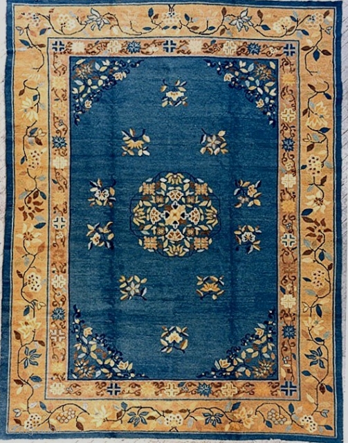 From the estate of a friend, a lovely antique western China/Mongolian carpet, approx. 9x12 feet, c. 1900-20, with pale blue ground and cotton foundation. Bold decorative undulating vine border in attractive harmonious  ...