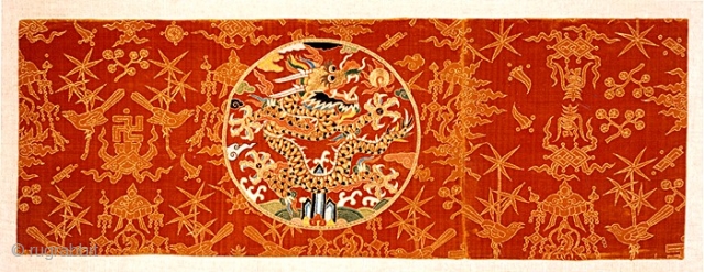 Panel from an Imperial robe, late Ming, or early, Qing dynasty, silk velvet ground with gold embroidered roundel, 14x41 inches.             