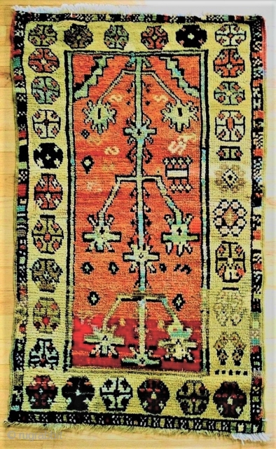 
Small format prayer rug from Konya/Capadoccia, circa 1800-25. Very unusual village-woven collector piece. Bold scale archaic Tree of Life beneath the stepped mihrab arch. Small spots of Old reweaves, re-selvaged. 25 x  ...