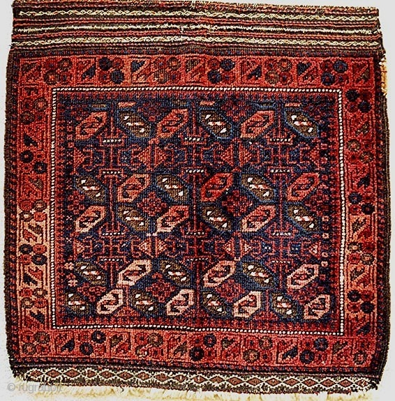 Sweet Baluch khorjin face, classic pattern, good spacing, earlier than many and in good condition with nice oxidation in some details. Minor blip on one selvedge. Elaborate warp finishes top and bottom.  ...