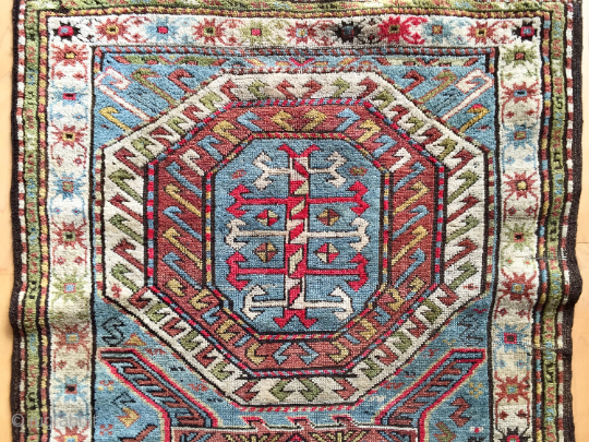 Origin and description: Caucasian carpet with traditional stars´ borders and a main field between Farchalo and Karachopf designs. Interesting dominance of green colour.

Age: around 100 years old.

Dimensions: 224 cm x 107 cm.

Condition:  ...