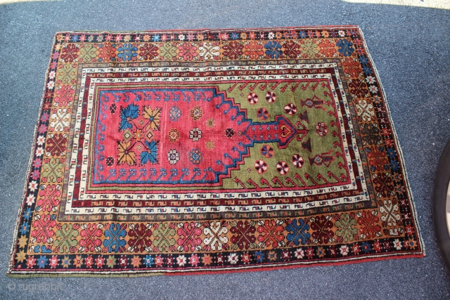 Turkish Mudjar prayer rug. 19th century. Size is 60" x 44 1/2". Ends and sides are complete but no kilim remains on either end. Nice green background and some natural purple.   ...