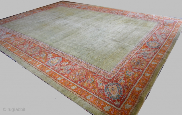 Rare and Beautiful 1900 Turkish Oushak 12'1 x 15'9, open grass green field with an amazing array of all natural colors including, reds, orange, blues, green, gray, pink and gold.  In  ...