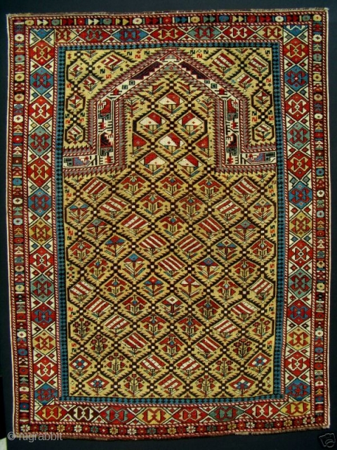 GREAT RARE YELLOW FIELD ANTIQUE CAUCASIAN MARASALI SHIRVAN PRAYER RUG

Classic textbook design with 100% natural dyes. It possesses evenly low allover pile condition to the tops of the knots. Minor repairs to  ...