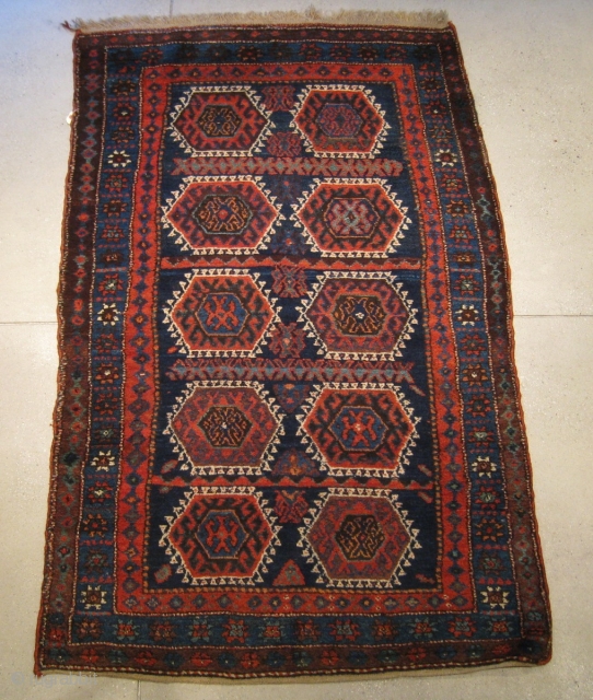 A late 19th Century Kurdish rug, 6' 0" x 3' 9", in original, excellent condition (no repairs, original webbing on both ends).           
