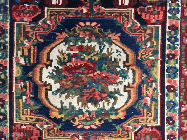 Bakhtiari Gol Farang "Foreign Flower" decorative rug. 7'X 4'-5". Very good condition with good pile. All the colors of the rainbow with no harsh colors. A decorator's delight! Minor end loss, secured,  ...