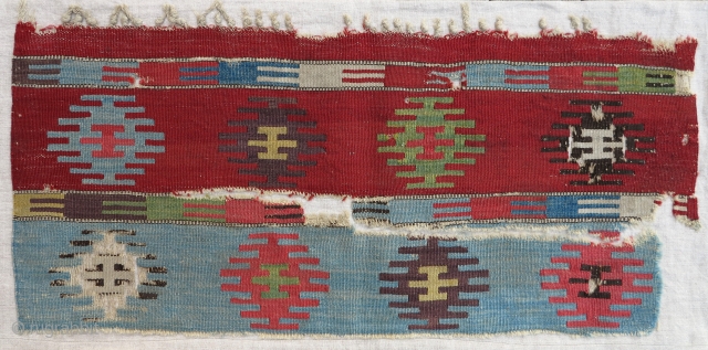 Early Anatolian Kilim fragment, 18th century, 35x70cm, supreme qualities, mounted, this fragment is one of the ends of probably a world class kilim half (original warp endings and selvages)...    