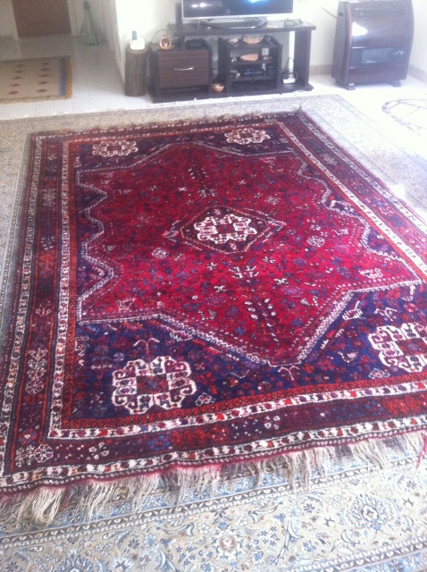 This antique rug is an old hand knotted Qashqai(also known as Shiraz), came in 308cm * 210cm, made of fully saturated shiny colored goat hair. The flowers and shapes are woven beautifully  ...
