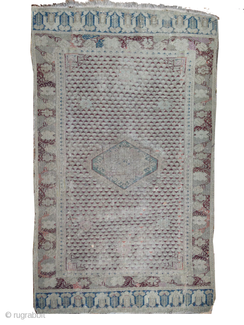 18th century rug. fine weave. size approximately 2' x 3'6".  mends, repairs/restorations varying in expertise, back side border and center have very old glue. some splits, faux applied fringe sewn on  ...