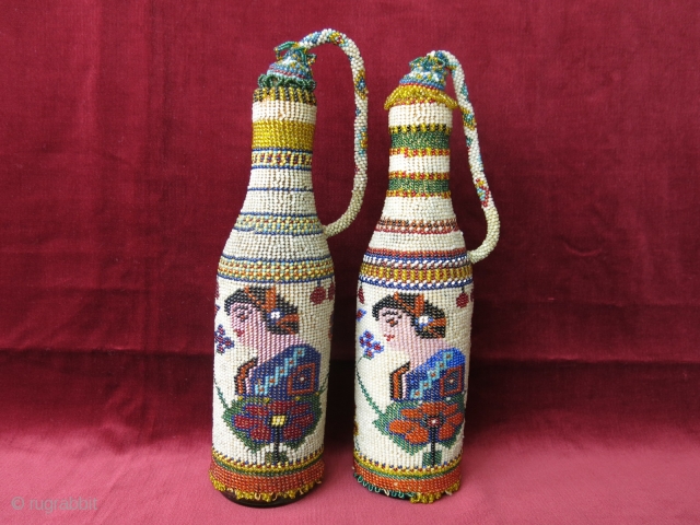 A pair of antique micro glass beaded bottle jackets. Presumably made by Greeks in Western Turkey in late 19th century. Despite their age, they are in great condition. Even the corks are  ...