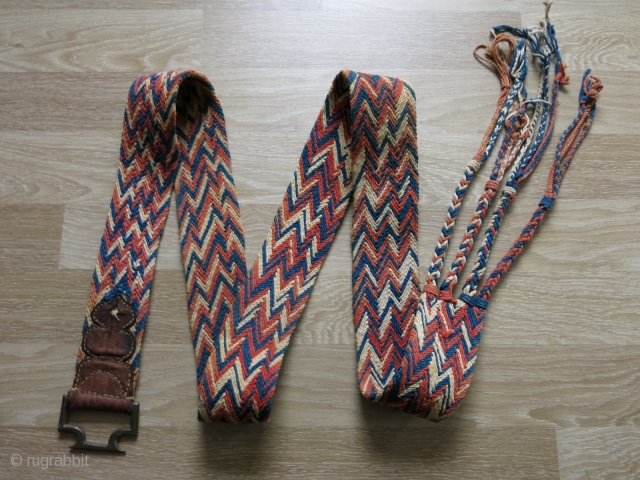 Traditional camel decoration belt from Rajasthan, India. It is cotton weaving with natural dyes. It has nice tassels along with a in drop metal buckle, which is decorated with leather. It is  ...