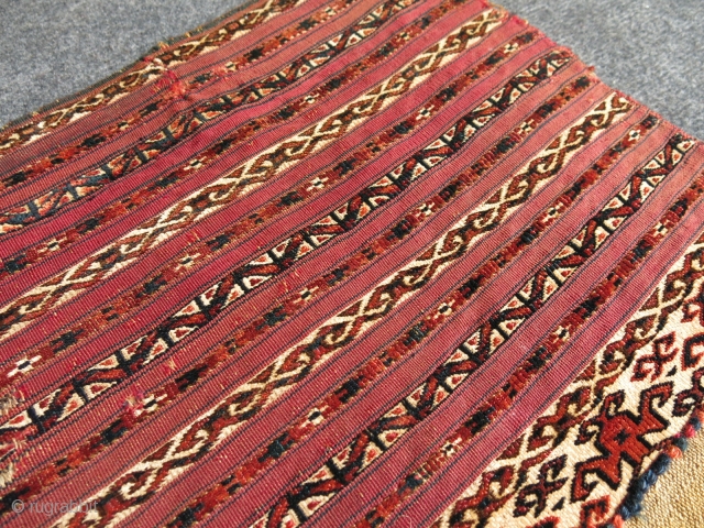 Turkmen Tekke mini akh chuval. Second half of 19th century. Some wears stitched. 
Size: 85 cm x 38 cm (33.5"x 15").            