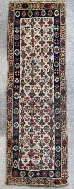 South Caucasian or Northwest Persian Shahsavan Fragment of a Long rug with flowers on an ivory ground - could benefit from a bath - 2'6 x 7'7 - 76 x 235 cm.  ...