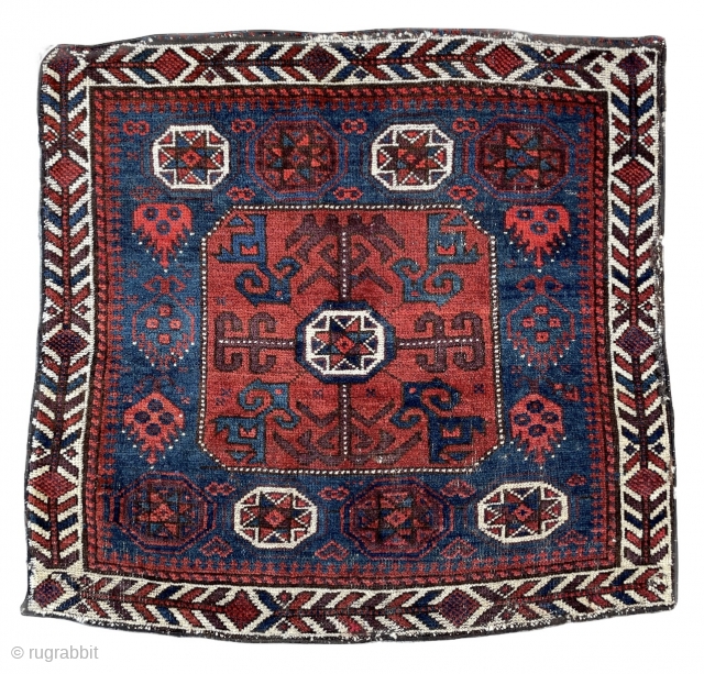 Beautiful Baluch Bagface with Star in octagon pattern and pomegranates jewelry ? on the sides framed by a nicely drawn ivory border. 
19th century 
31” x 29” - 78 x 73 cm. 