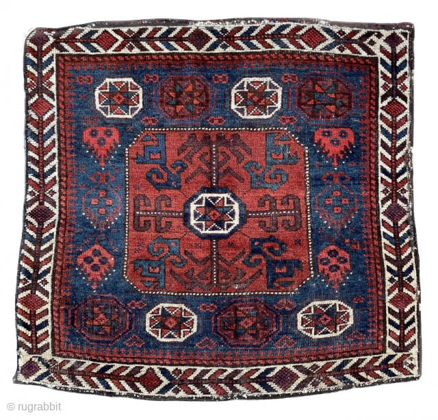 Beautiful Baluch Bagface with Star in octagon pattern and pomegranates jewelry ? on the sides framed by a nicely drawn ivory border. 
19th century 
31” x 29” - 78 x 73 cm. 