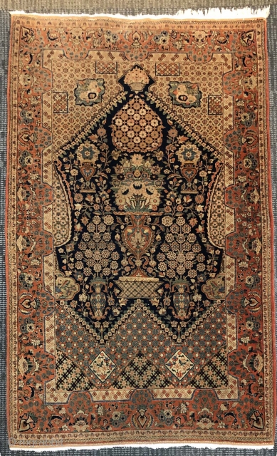 Antique Kashan, c. 1930. 8'6" x 4'5". Haj Khanoumi design in ochre, indigo, and teal green. Wool on cotton. Finely knotted, low even pile with some minor wear at the edges. Professionally  ...