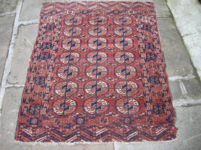 An antique tekke wedding rug, 4ft6 x 3ft6 good colours and interesting design, very slightly worn ,new find will clean well,much nicer than the pics suggest.       