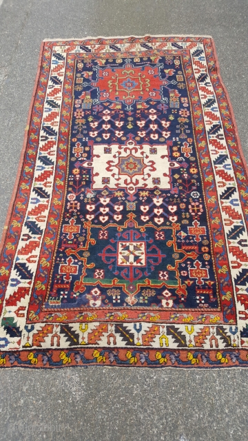 A lovely antique karaja fragment rug. Made out of a longer rug one end has been rewoven. Great colours including an early aubergine. The rug in mostly in pile and ends and  ...