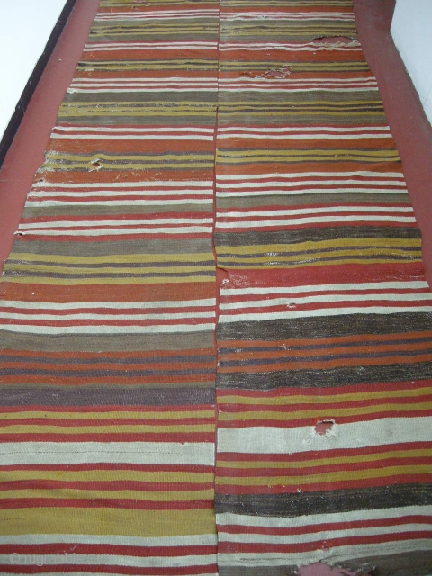 early 19th century Anatolian kilim in two parts. Some holes but repairable. Good early colours. 12ft x 4ft4 .              