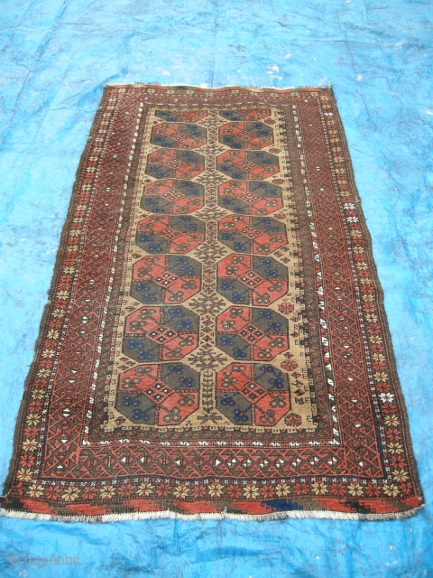 An attractive antique Beluch rug c1900, camel ground with piled ends. Lightly worn with some corrosion, could benefit from a ligth clean. 6ft x 3ft6 approx.       