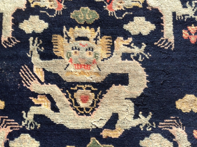   

 Here is a whimsical Tibetan Dragon sitting mat. Probably
 dating to the early 1900's or possibly earlier. The mat
 measures 24" X28" (61 cent. X 71 cent.) and is  ...