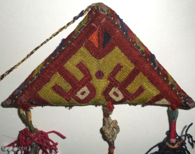 Here is a beautifull old Chodor Turkoman embroidered Talisman/Amulet which would have been worn to ward off evil/bring good luck. The talisman which apears to create one eyed burgandy spacemen in the  ...