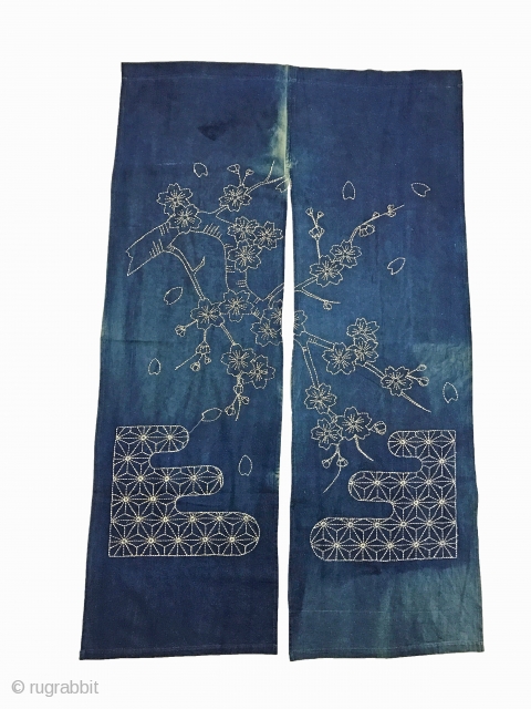 A beautiful antique room divider or entrance curtain (noren) with traditional ornamentation and cherry blossom motive in sashiko stitching. The fabric is in absolutely perfect condition and can be used without any  ...