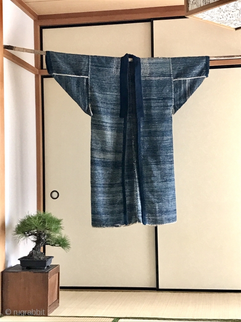 A stunning fisherman's coat from Aomori. A thickly woven jacket worn by a fisherman, probably a man with a higher rank. The condition is outstanding with stitching around neck and armpits. Superstitious  ...