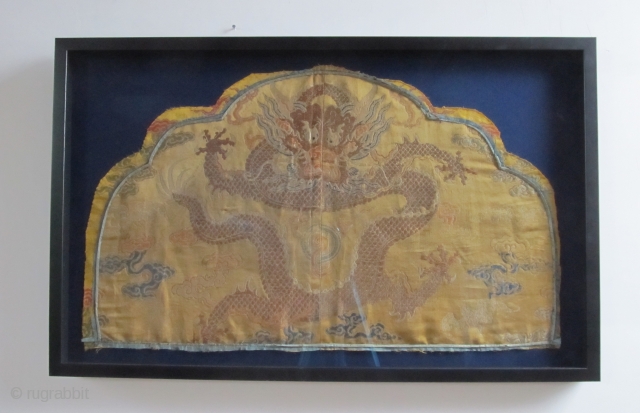 Rare fragment of a weaving for a semiformal imperial court robe, the 5 clawed dragon suggesting it was intended for the emperor or empress. Gold brocaded silk with a central Long among  ...