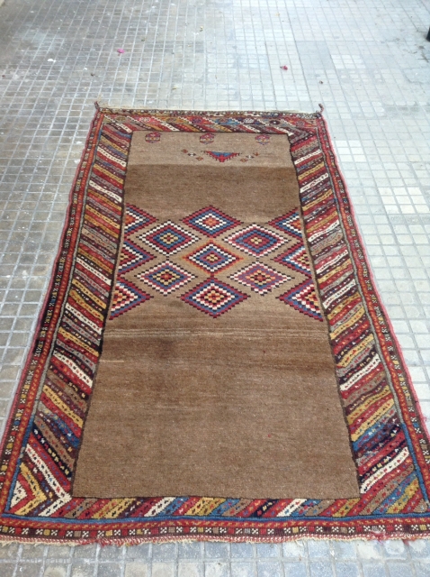 Rare Kurdish Antique Camel ground th1850 very good condition and full pile.
Size .225x125                    
