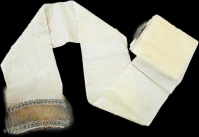 Antique white silk turban with golden border.                          