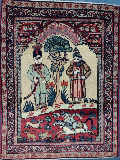 This is an antique Kerman Ravar Rug woven circa 19th century and it measures 76 x 57 in CM. It has a pictorial design with Persian calligraphy with beautiful colors.   