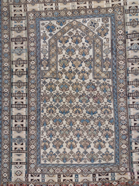 This is an antique Daghestan rug woven circa 1920 and it measures 140 x 120 in CM.
It features a beautiful mihrab design on a nice color, filled with amazing ethnic designs and  ...