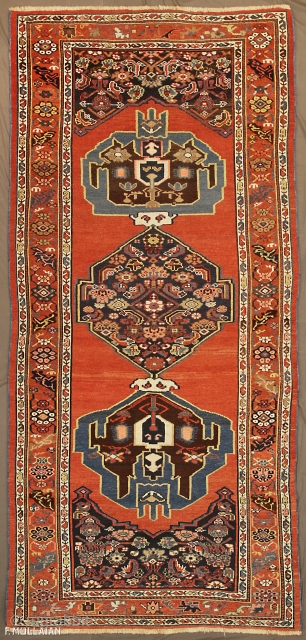 Antique Persian Bijar (Bidjar) Runner Rug, 19th Century,

260 × 120 cm (8' 6" × 3' 11"),


The soft rust-red plain field with single Blue and deep indigo large and hooked medallion at each  ...