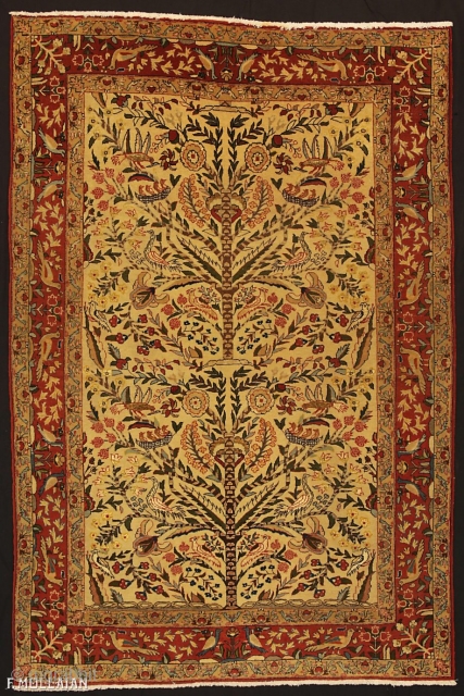 This is an antique Qum rug from central Persia woven between the 1920-1950s. The rug has a tree of life design with many different flower and bird motifs. The rug has been  ...