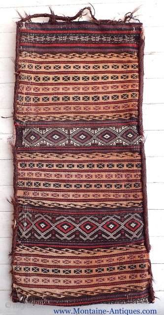 Balouchi Soumak Long Bag-- Circa 1900 or older. 16 x 33 inches.Very finely woven w/ crisp graphic design. Striped kelim back w/ pile on the bottoms. Abundant use of goat hair on  ...