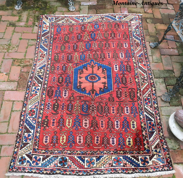 Bahktiary-- 4.7 x 6.5-- Small repetitive botehs and hearth medallion on red field. Unique tribal design in very good condition. ($20 USA shipping)          