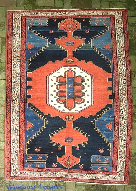 Malayer-- 4 ft 5 x 7 ft 2. Sarouk weave with ferocious open field design. We just posted a whole slug of fresh stuff. Check it out @ http://www.montaine-antiques.com/oriental-rugs/    